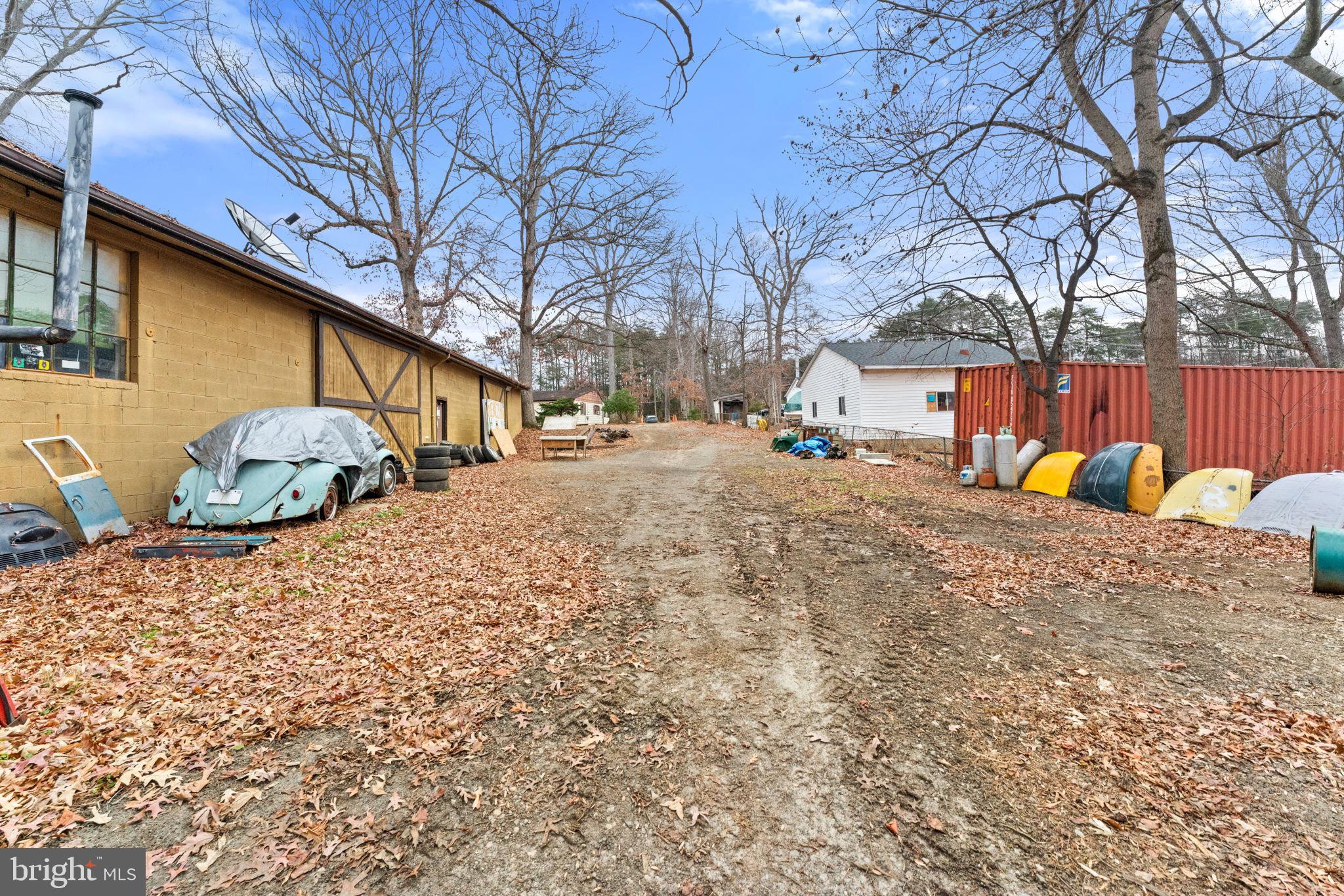 8906 Hooes Road Fairfax Station, VA 22039 - Photo 18 of 45 a backyard of a house with fire pit and chairs