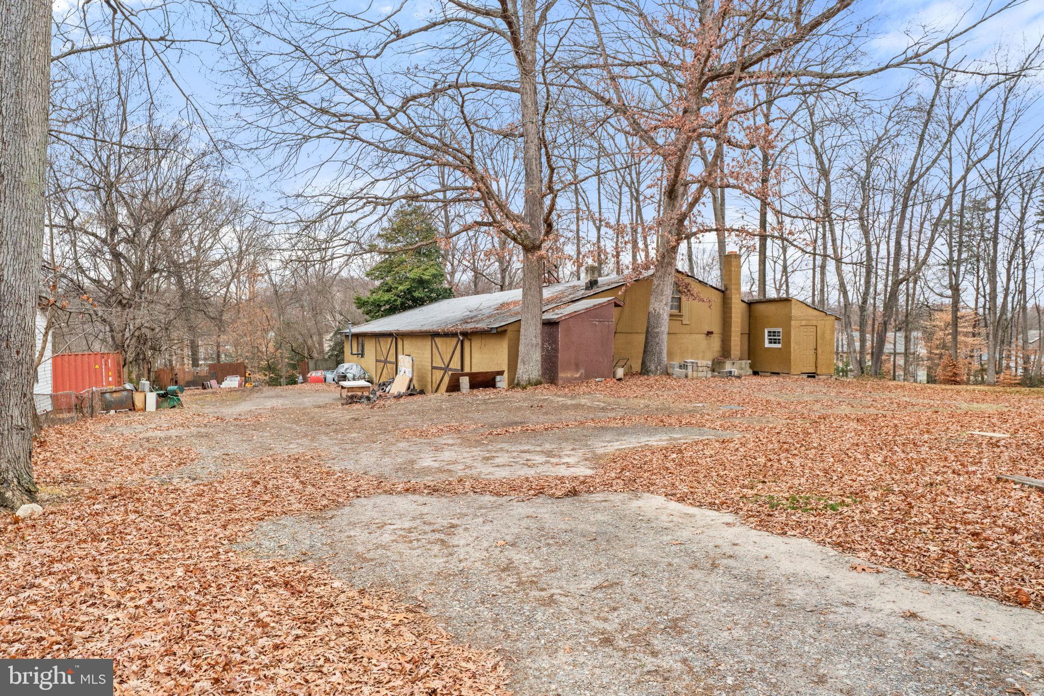 8906 Hooes Road Fairfax Station, VA 22039 - Photo 21 of 45 a front view of a house with a yard covered in snow