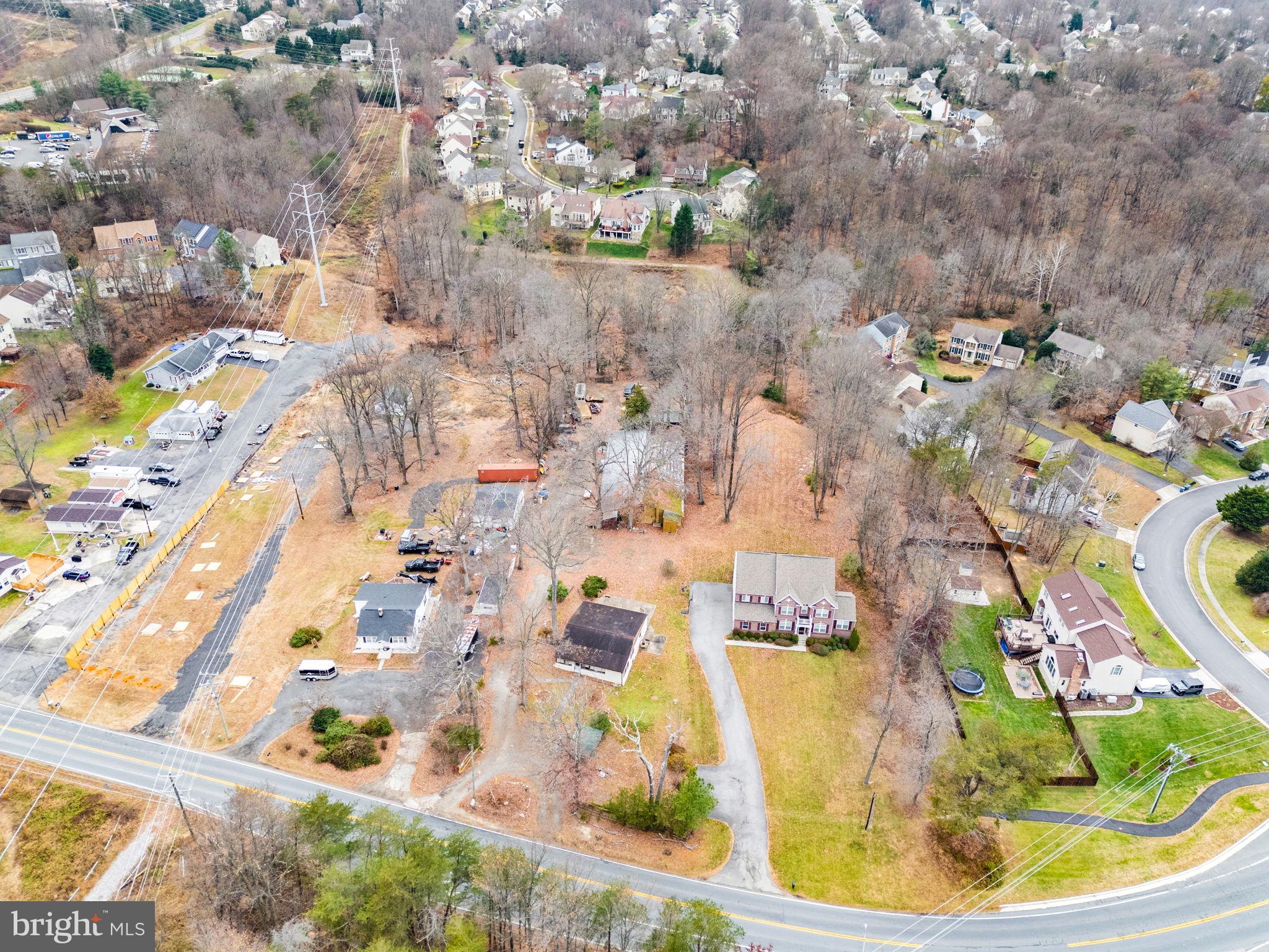 8906 Hooes Road Fairfax Station, VA 22039 - Photo 3 of 45 an aerial view of residential houses with outdoor space