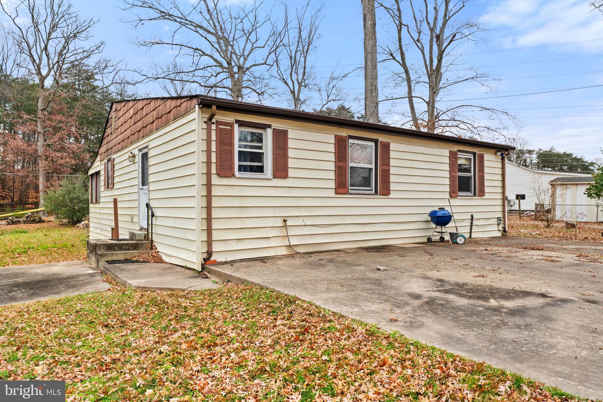 8906 Hooes Road Fairfax Station, VA 22039 - Photo 33 of 45 a view of a house with a patio