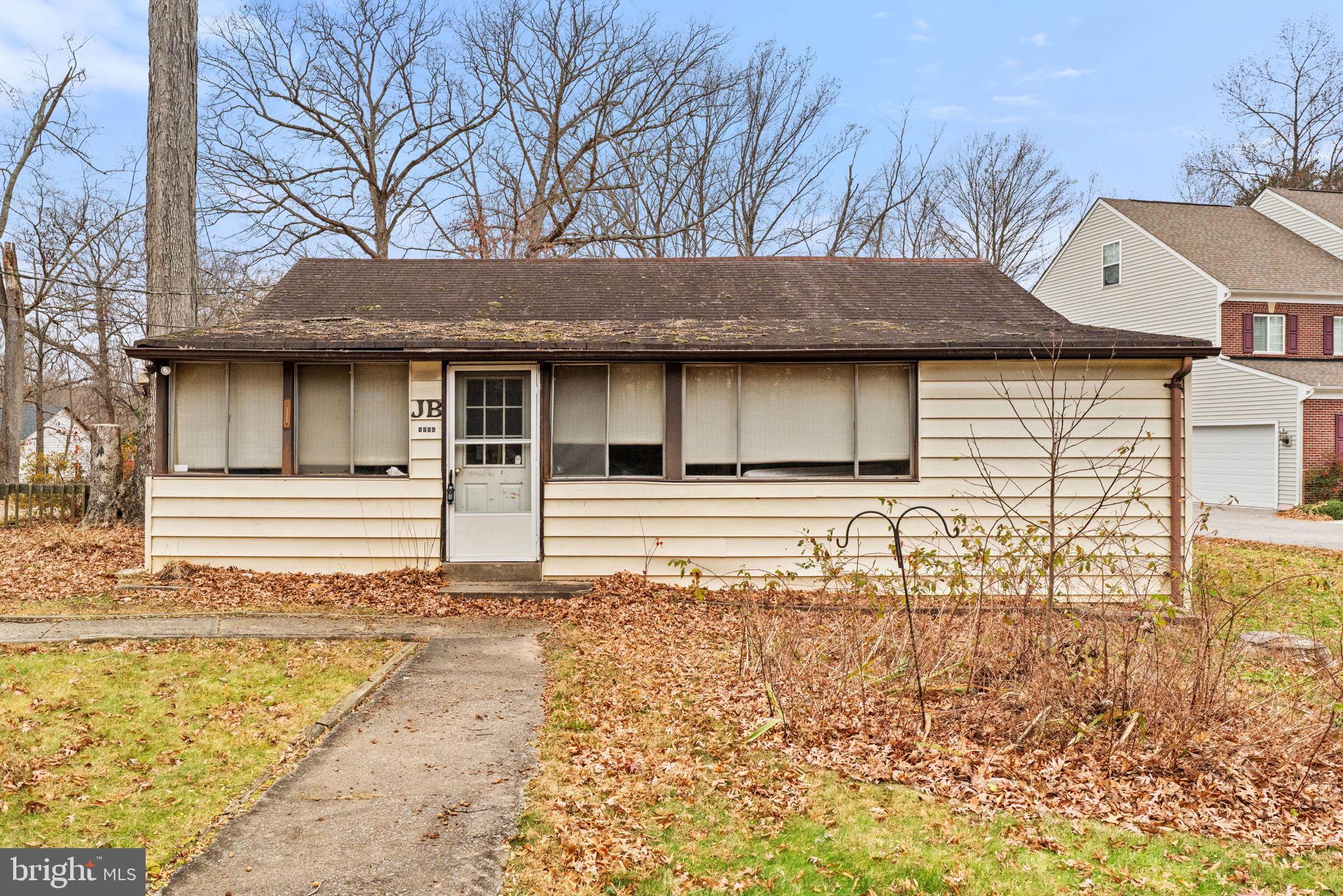 8906 Hooes Road Fairfax Station, VA 22039 - Photo 34 of 45 a house with trees in the background