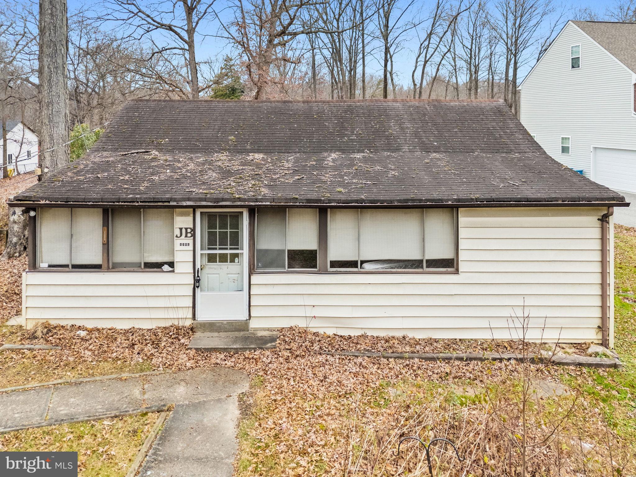 8906 Hooes Road Fairfax Station, VA 22039 - Photo 39 of 45 a front view of a house with a garden
