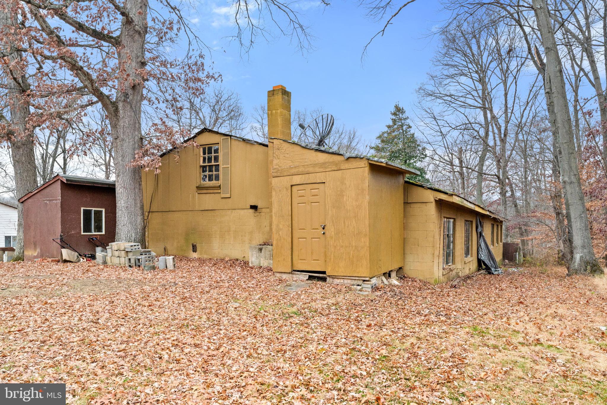 8906 Hooes Road Fairfax Station, VA 22039 - Photo 6 of 45 a blue sign that is sitting in front of a house