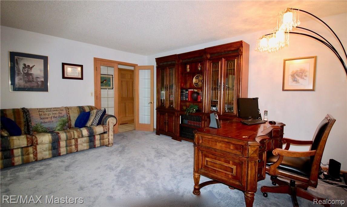 26454 Rinne Road New Boston, MI 48164 - Photo 10 of 41 Library can be closed off so whatever the business is, there is privacy! Your custom cabinetry will look gorgeous here