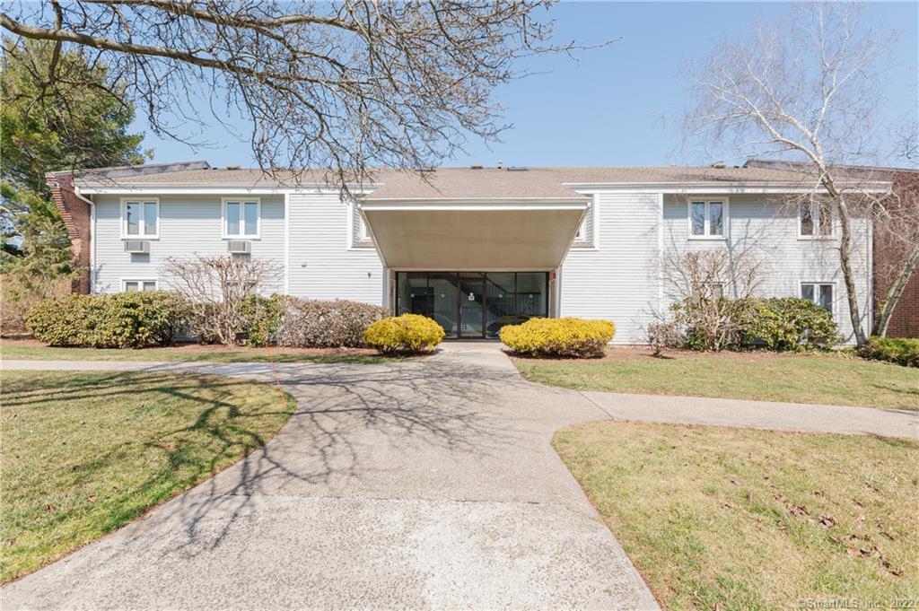 119 Florence Road, Unit 1B Branford, CT 06405 - Photo 1 of 1 front view of a house with a yard and potted plants