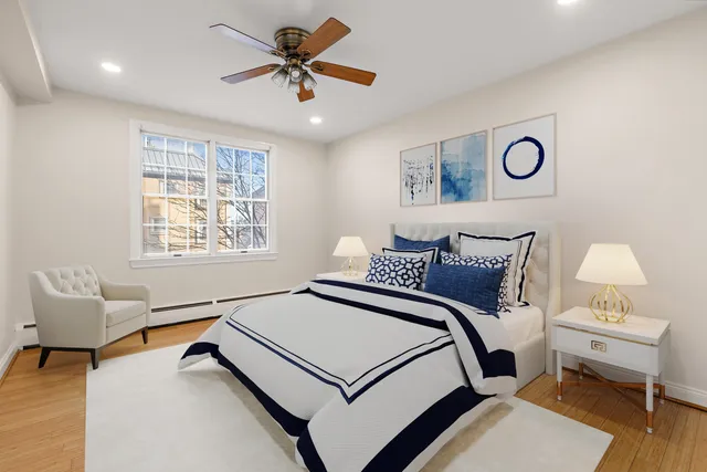 a bedroom with a bed and a couch