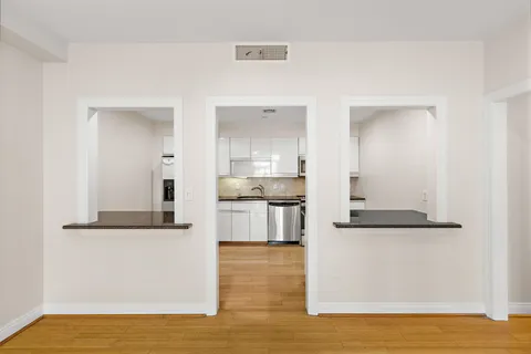 a view of kitchen with wooden floor