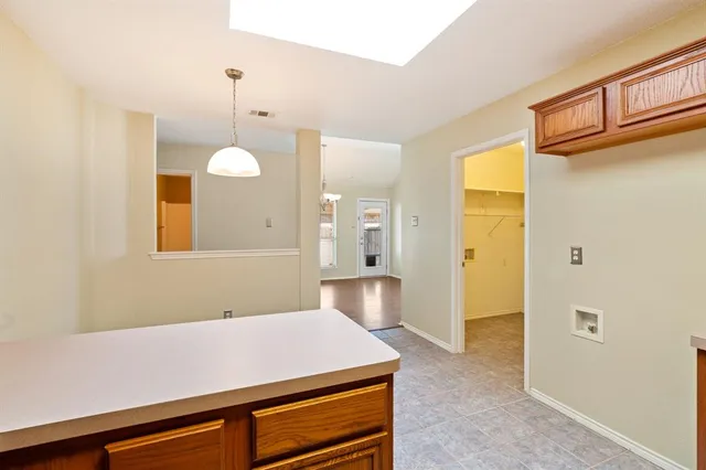 a room with cabinets and wooden floor