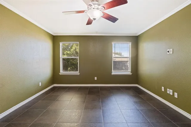 a view of room with window and ceiling fan