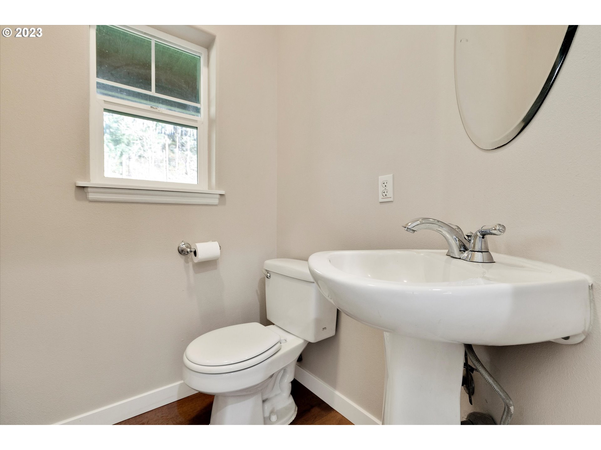 19053 South Mattoon Road Estacada, OR 97023 - Photo 22 of 47 a bathroom with a sink a toilet and a mirror