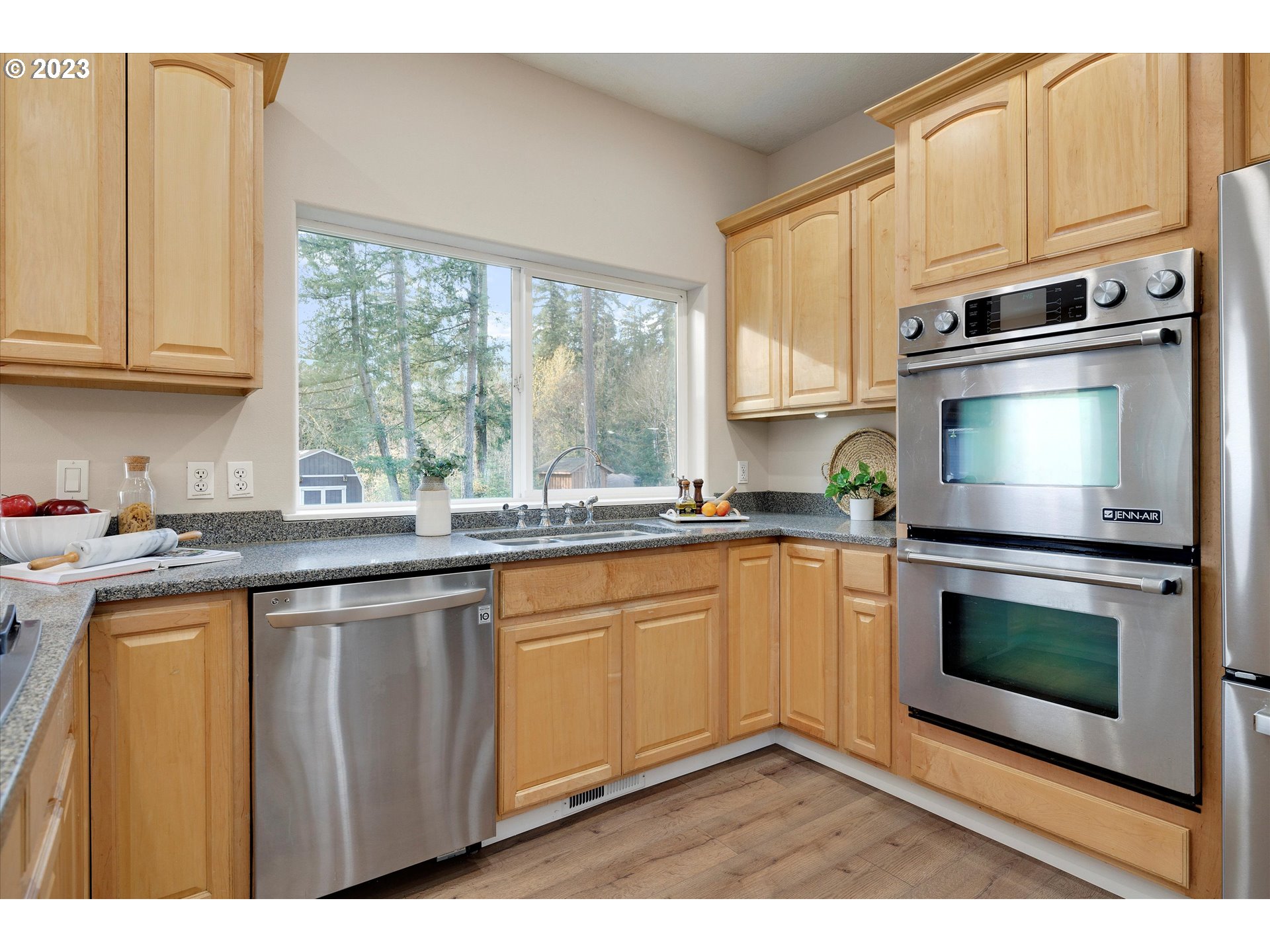 19053 South Mattoon Road Estacada, OR 97023 - Photo 8 of 47 a kitchen with stainless steel appliances granite countertop a stove a sink and a microwave