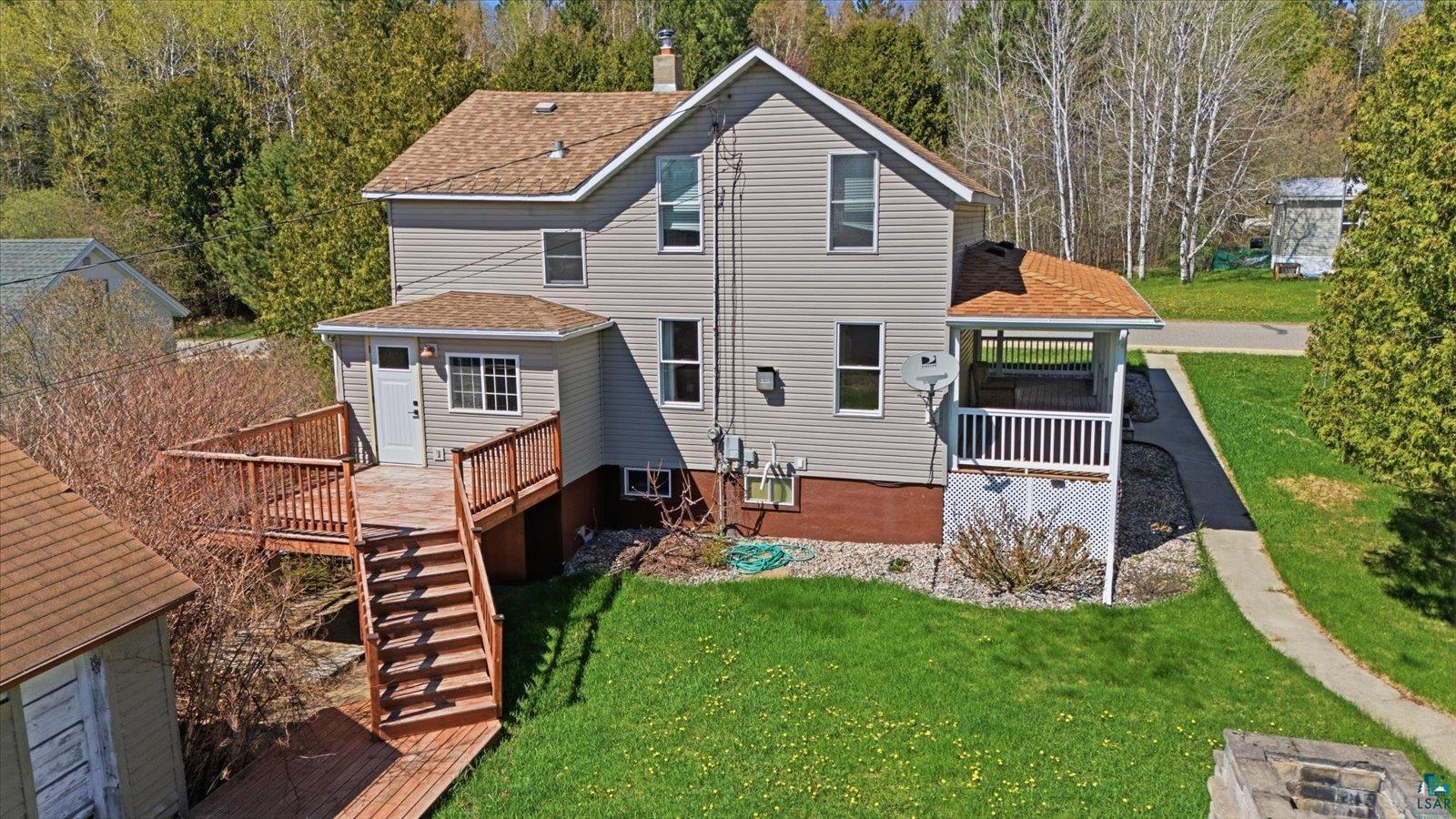 50 Main Street Soudan, MN 55782 - Photo 9 of 31 Two-story residence featuring light gray siding and a brown shingle roof