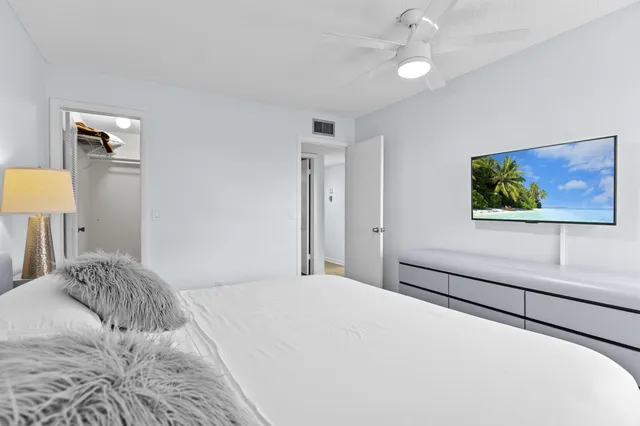 a view of a chairs and table in the balcony