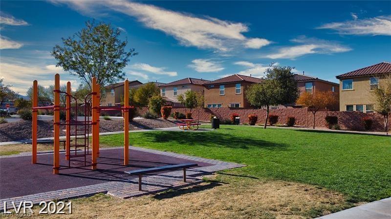 5475 Ordesa Valley Road Las Vegas, NV 89148 - Photo 2 of 35 A community playground and green space offer vibrant outdoor living.
