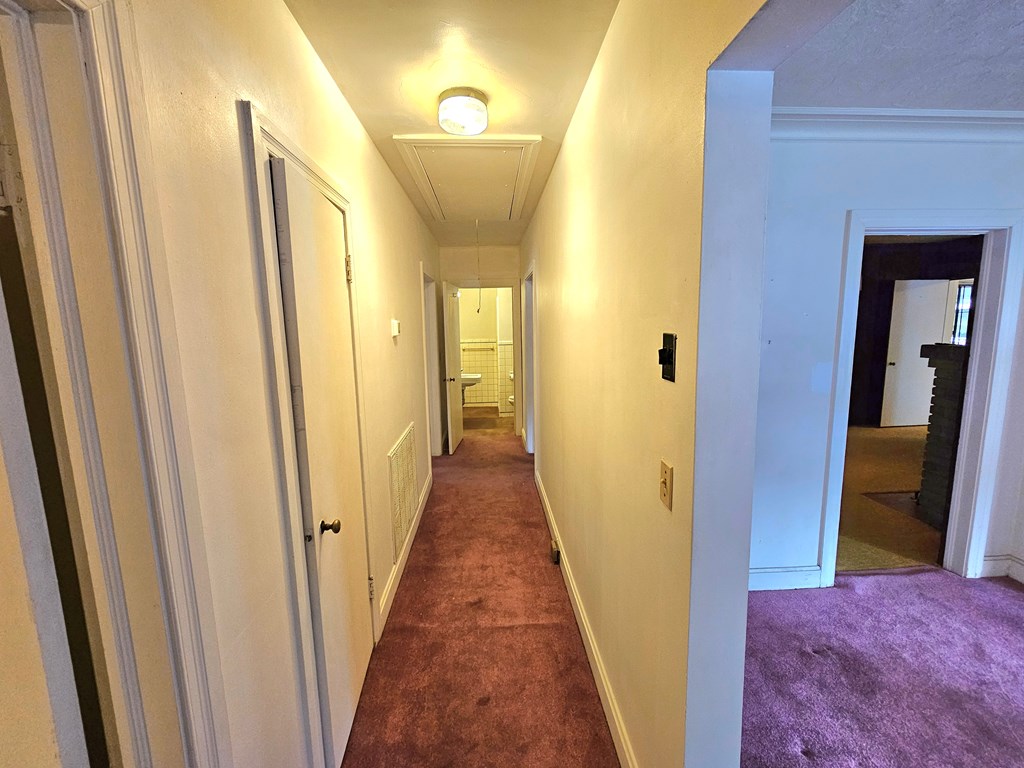 752 Portland Avenue Columbus, GA 31906 - Photo 13 of 31 a view of a hallway with a wooden door