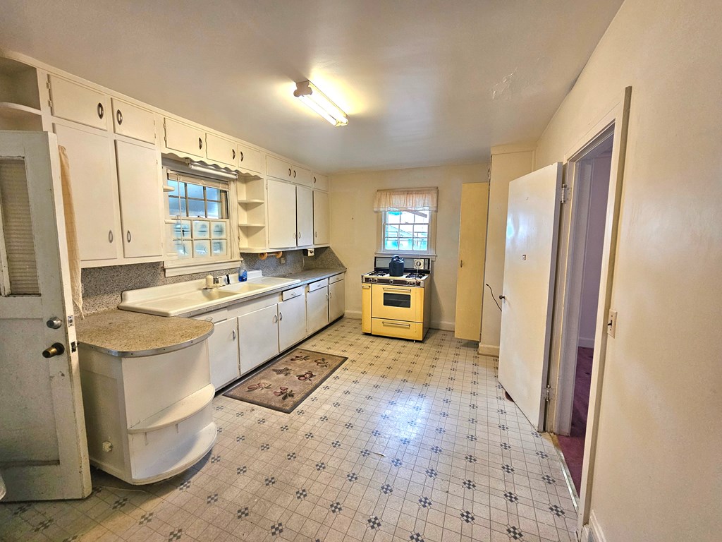 752 Portland Avenue Columbus, GA 31906 - Photo 15 of 31 a kitchen with a sink stove and refrigerator