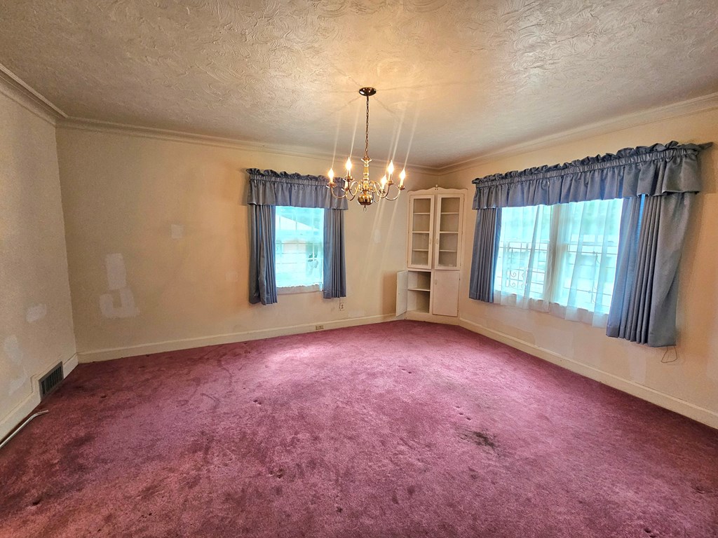 752 Portland Avenue Columbus, GA 31906 - Photo 19 of 31 an empty room with windows and entrance
