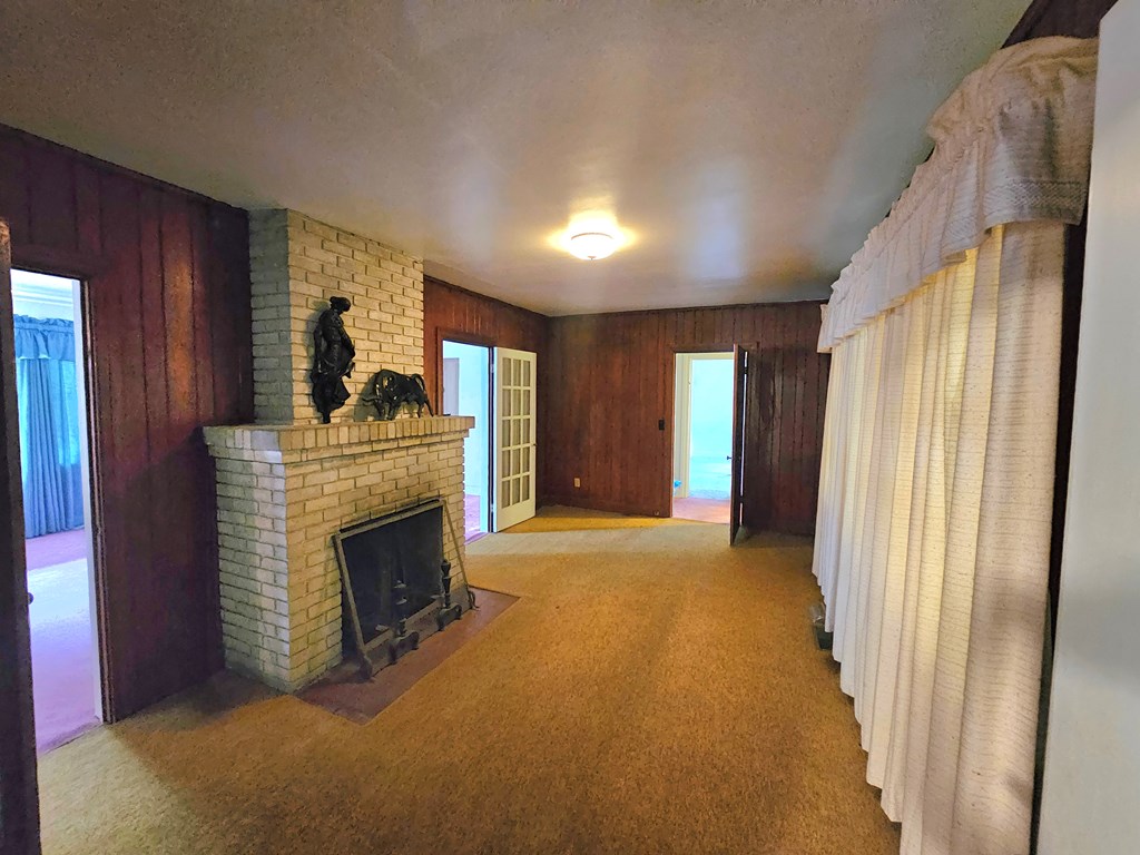 752 Portland Avenue Columbus, GA 31906 - Photo 21 of 31 a view of an empty room with a fireplace and a window
