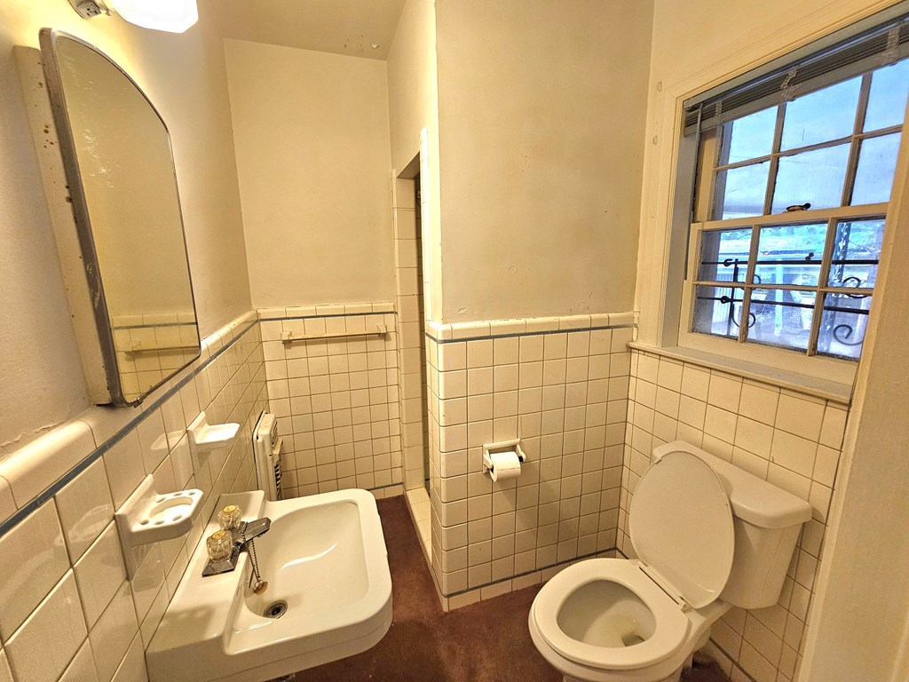 752 Portland Avenue Columbus, GA 31906 - Photo 26 of 31 a bathroom with a toilet and a sink