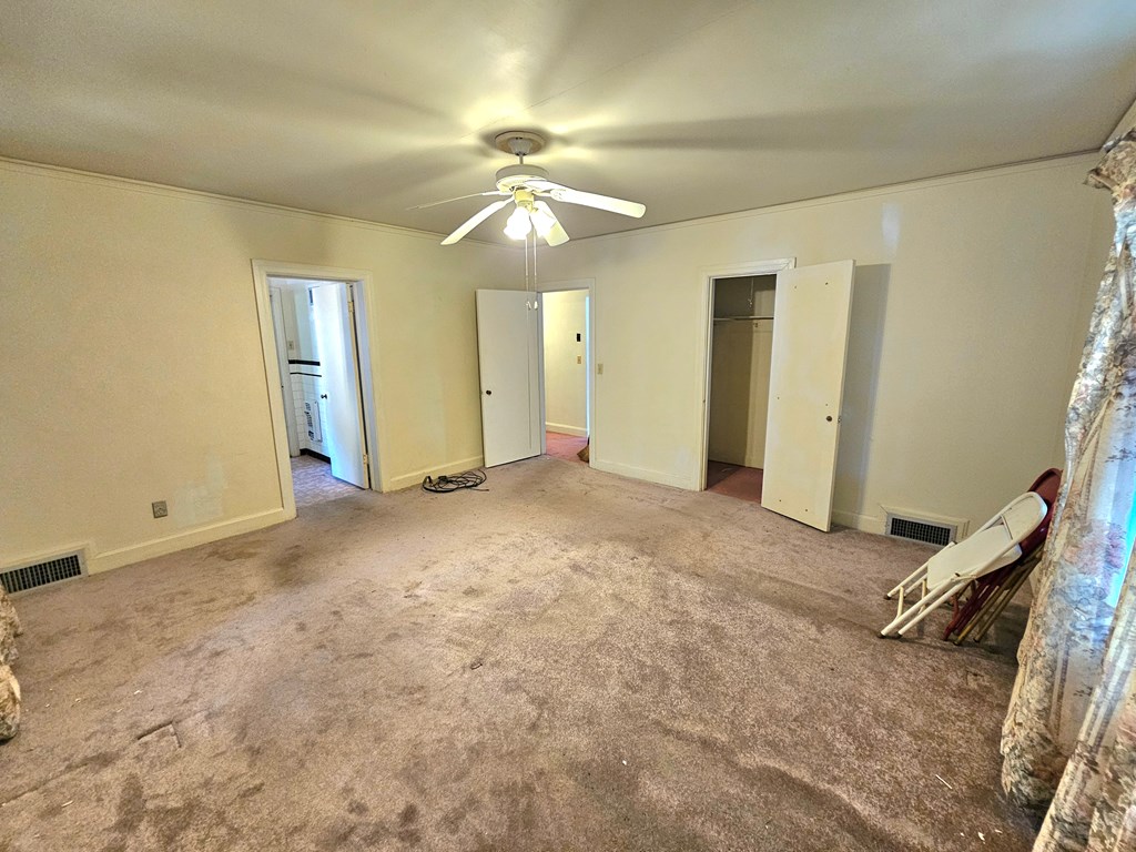 752 Portland Avenue Columbus, GA 31906 - Photo 27 of 31 an empty room with fan and entryway
