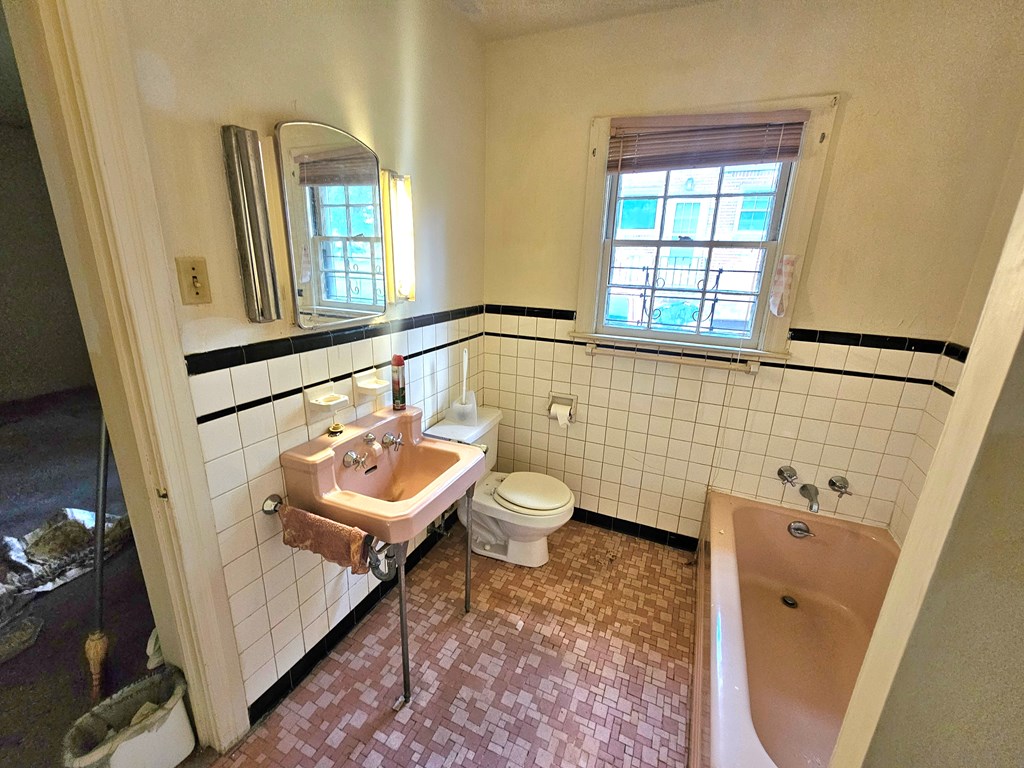 752 Portland Avenue Columbus, GA 31906 - Photo 30 of 31 a bathroom with a sink a toilet and a mirror