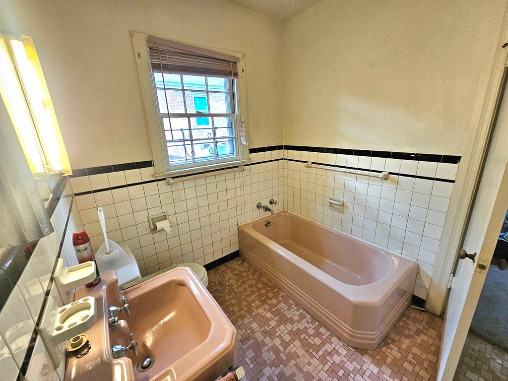 752 Portland Avenue Columbus, GA 31906 - Photo 31 of 31 a bathroom with a tub and shower