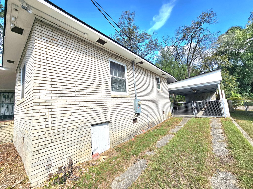 752 Portland Avenue Columbus, GA 31906 - Photo 6 of 31 a view of a house with a yard and a garage