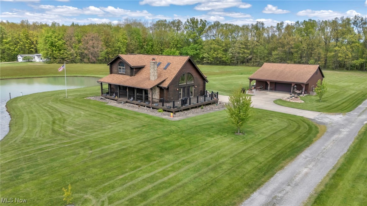 15180 Stoltz Road Diamond, OH 44412 - Photo 1 of 48 Drone / aerial view of house and pond