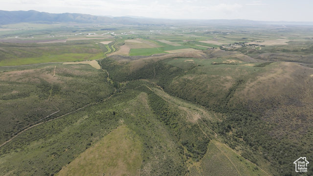 Aerial view of property's location with mountains and rural landscape