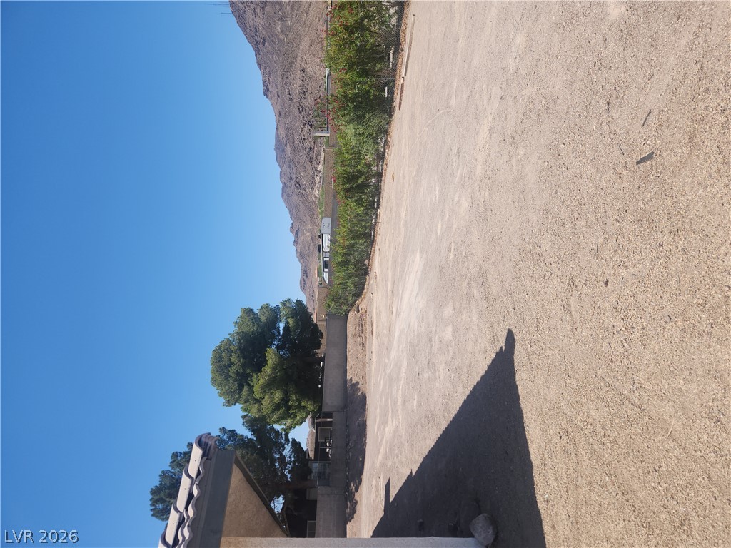 564 Ridgeway Road Henderson, NV 89015 - Photo 20 of 22 A spacious lot provides ample opportunity for development with a dramatic mountain backdrop.
