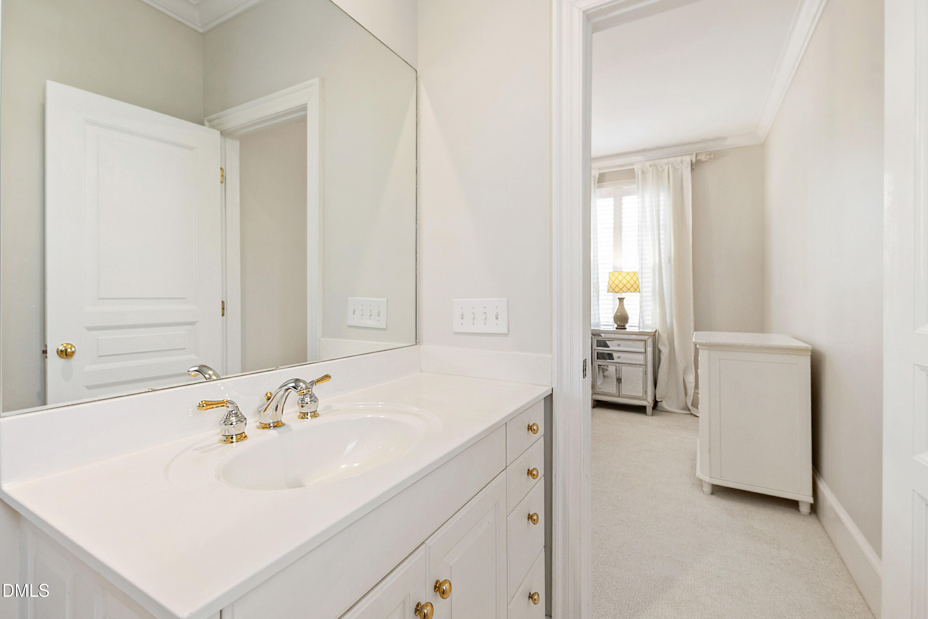 2536 Wake Drive Raleigh, NC 27608 - Photo 40 of 74 a bathroom with a sink and a mirror