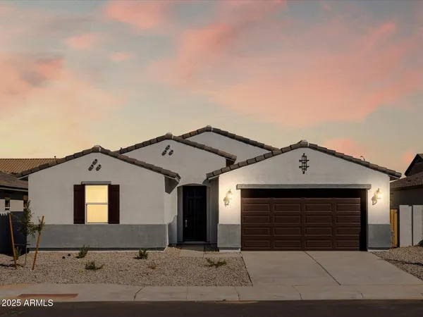 a front view of a house with yard