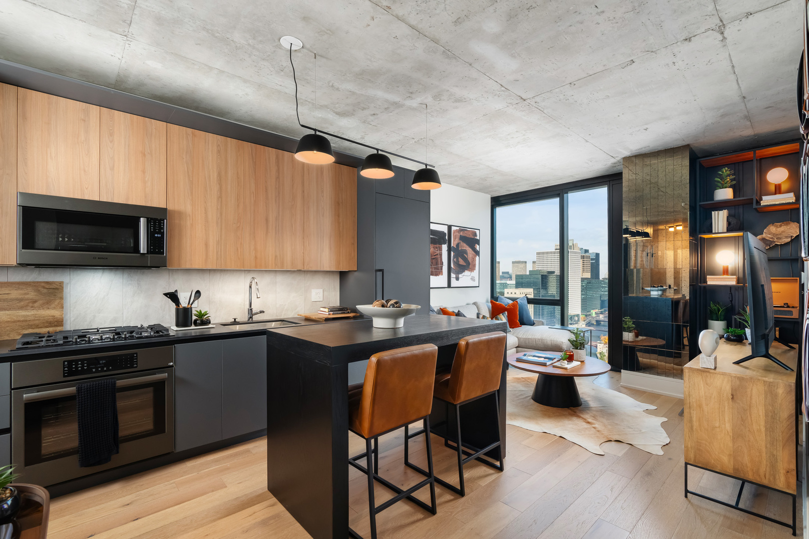 234 West Polk Street, Unit 3206 Chicago, IL 60607 - Photo 3 of 30 a kitchen with stainless steel appliances granite countertop a sink dishwasher a stove refrigerator and cabinets with wooden floor
