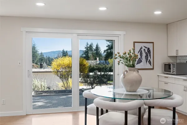 a dining room with furniture and window