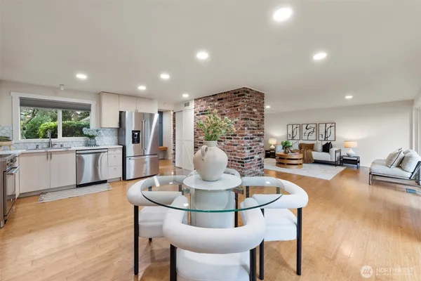 a kitchen with a table and chairs
