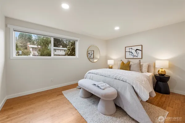 a bedroom with a bed and lamp