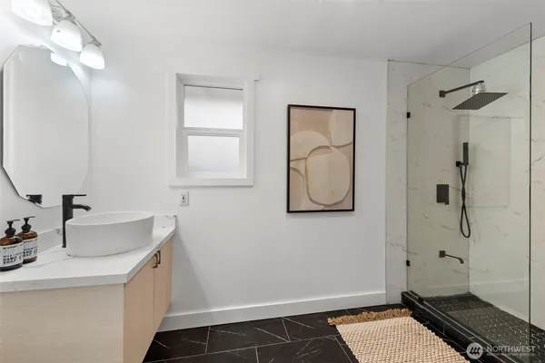 a bathroom with a sink and a mirror