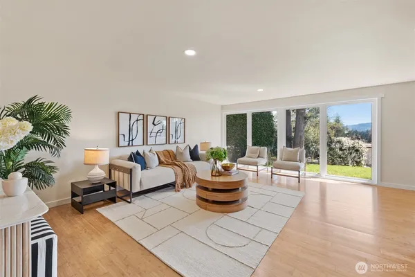 a living room with furniture and a large window