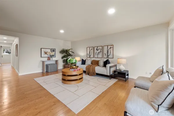 a living room with furniture and a potted plant