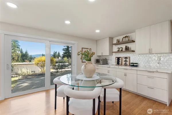 a kitchen with a table and chairs in it