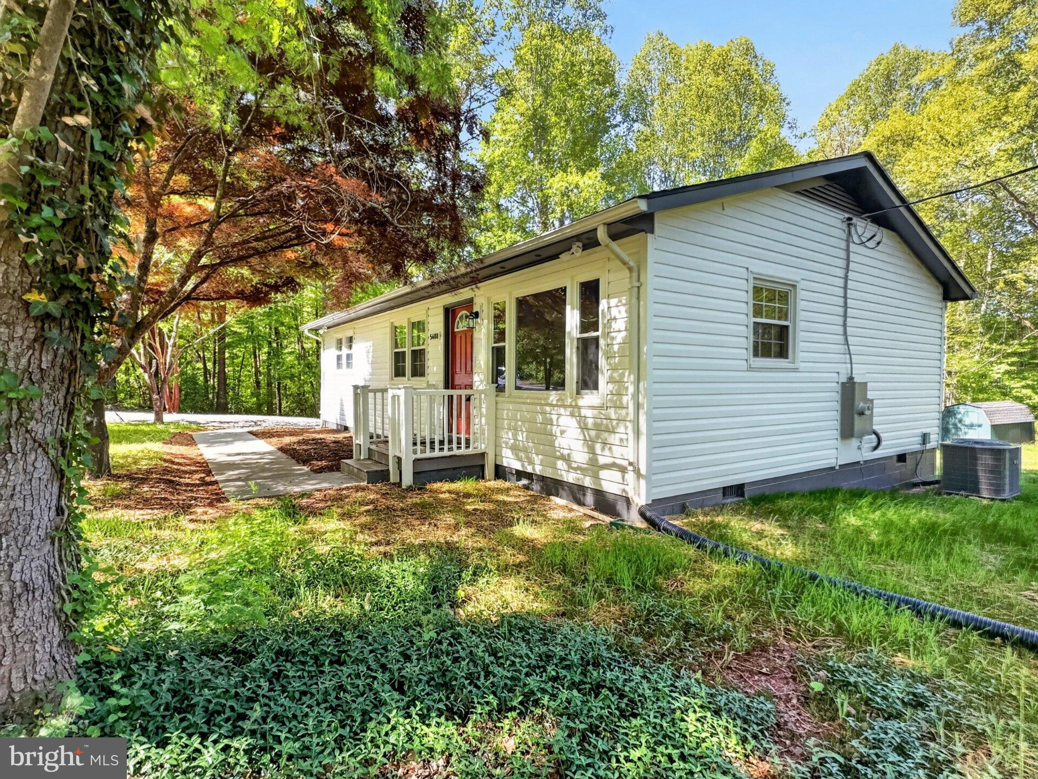 5408 Towles Mill Road Partlow, VA 22534 - Photo 3 of 24 Charming home nestled in lush greenery.