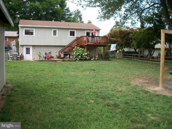 897 Beech Tree Road Severn, MD 21144 - Photo 2 of 30 a view of a house with a back yard
