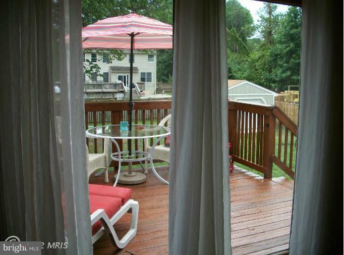 897 Beech Tree Road Severn, MD 21144 - Photo 12 of 30 a view of a chairs and table in the balcony