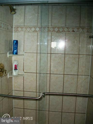 897 Beech Tree Road Severn, MD 21144 - Photo 14 of 30 a bathroom with a shower