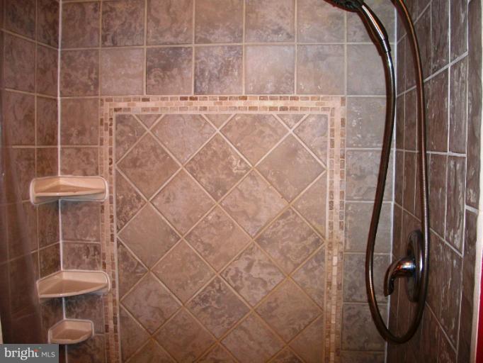 897 Beech Tree Road Severn, MD 21144 - Photo 15 of 30 a bathroom with a shower