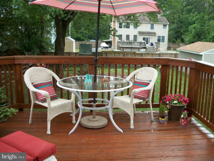 897 Beech Tree Road Severn, MD 21144 - Photo 23 of 30 a view of a chairs and tables in the balcony