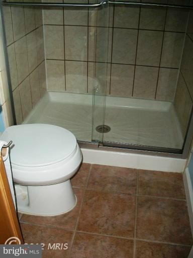 897 Beech Tree Road Severn, MD 21144 - Photo 7 of 30 a bathroom with a toilet and a shower