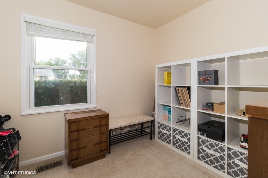 228 Murphy Drive Romeoville, IL 60446 - Photo 11 of 20 a room with furniture and a window