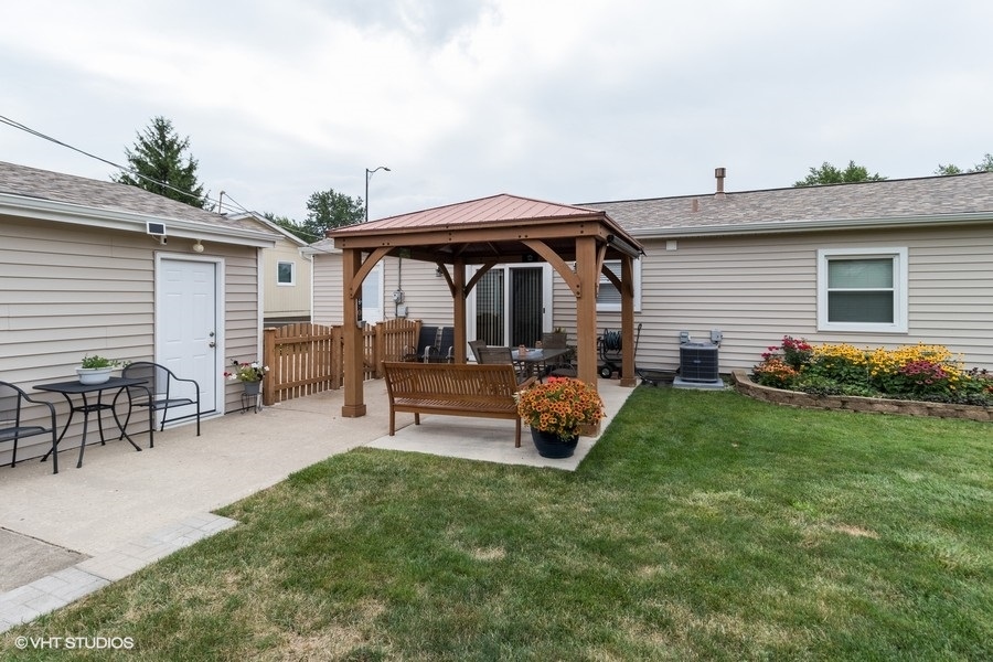 228 Murphy Drive Romeoville, IL 60446 - Photo 17 of 20 a view of outdoor space yard deck and patio