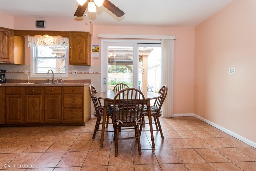 228 Murphy Drive Romeoville, IL 60446 - Photo 7 of 20 a view of a dining room with furniture and window